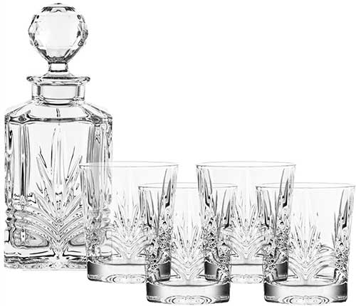 Galway Crystal decanter set includes four glasses; all are cut in the Kells...